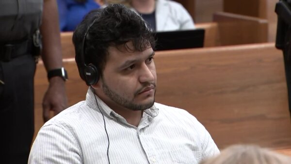 man wears headphones in court