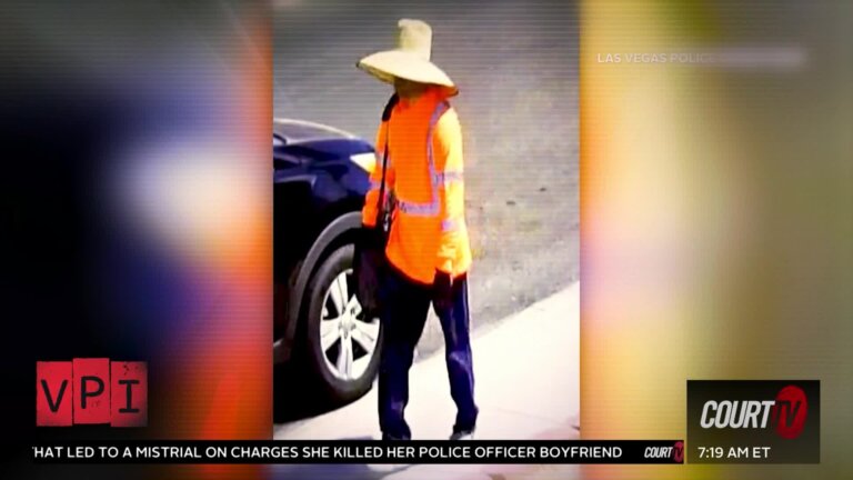 Man in orange vest and sun hat