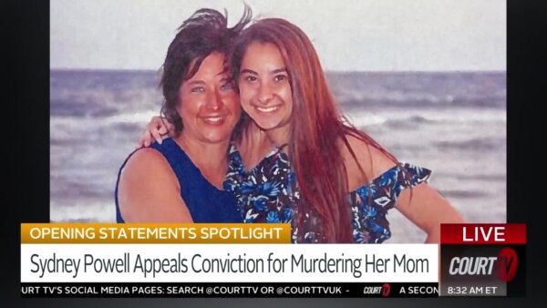 mother and daughter smiling at the beach