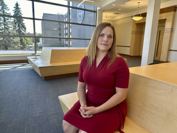 woman sits in lobby of courthouse