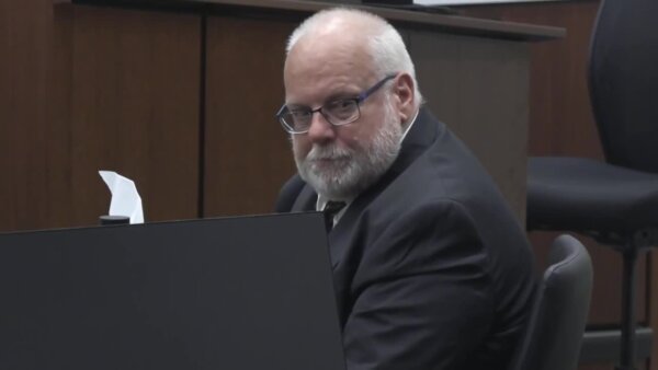 Large, bearded, white-haired defendant Kevin Sehmer looks straight at the camera.