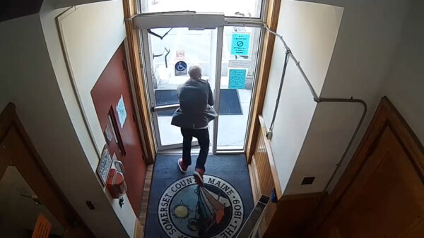 A man is seen running out of a door