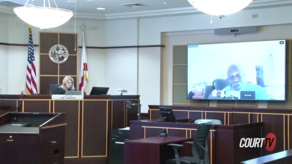 Judge in courtroom with man on screen