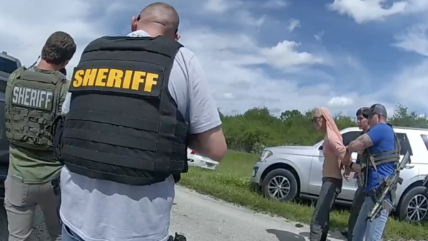 Authorities detaining Ryan Wesley Routh after a traffic stop in Florida