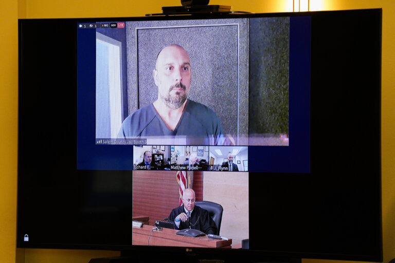 Sean Higgins and a judge are shown on a zoom screen in court