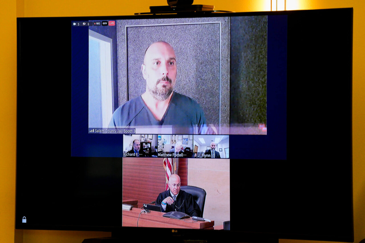 Sean Higgins and a judge are shown on a zoom screen in court