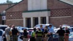 police gather outside high school