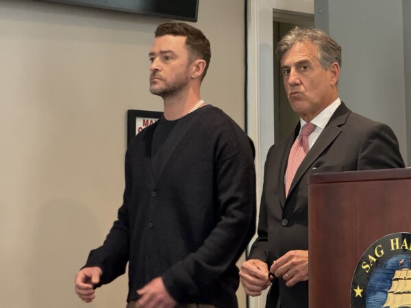 Pop singer stands next to attorney in Sag Harbor courtroom
