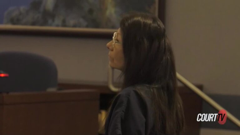 Convicted woman stands in court