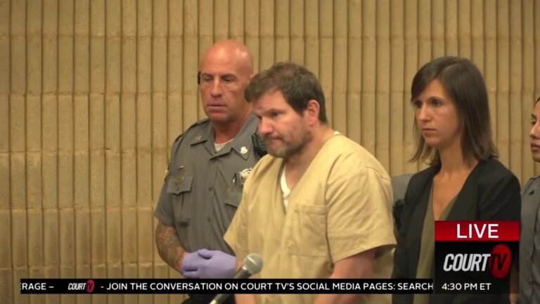 Ewen Dewitt stands in court