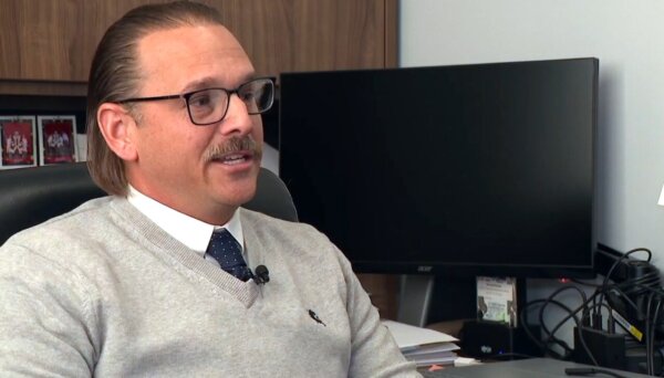 Nicholas McLeland sits in his office