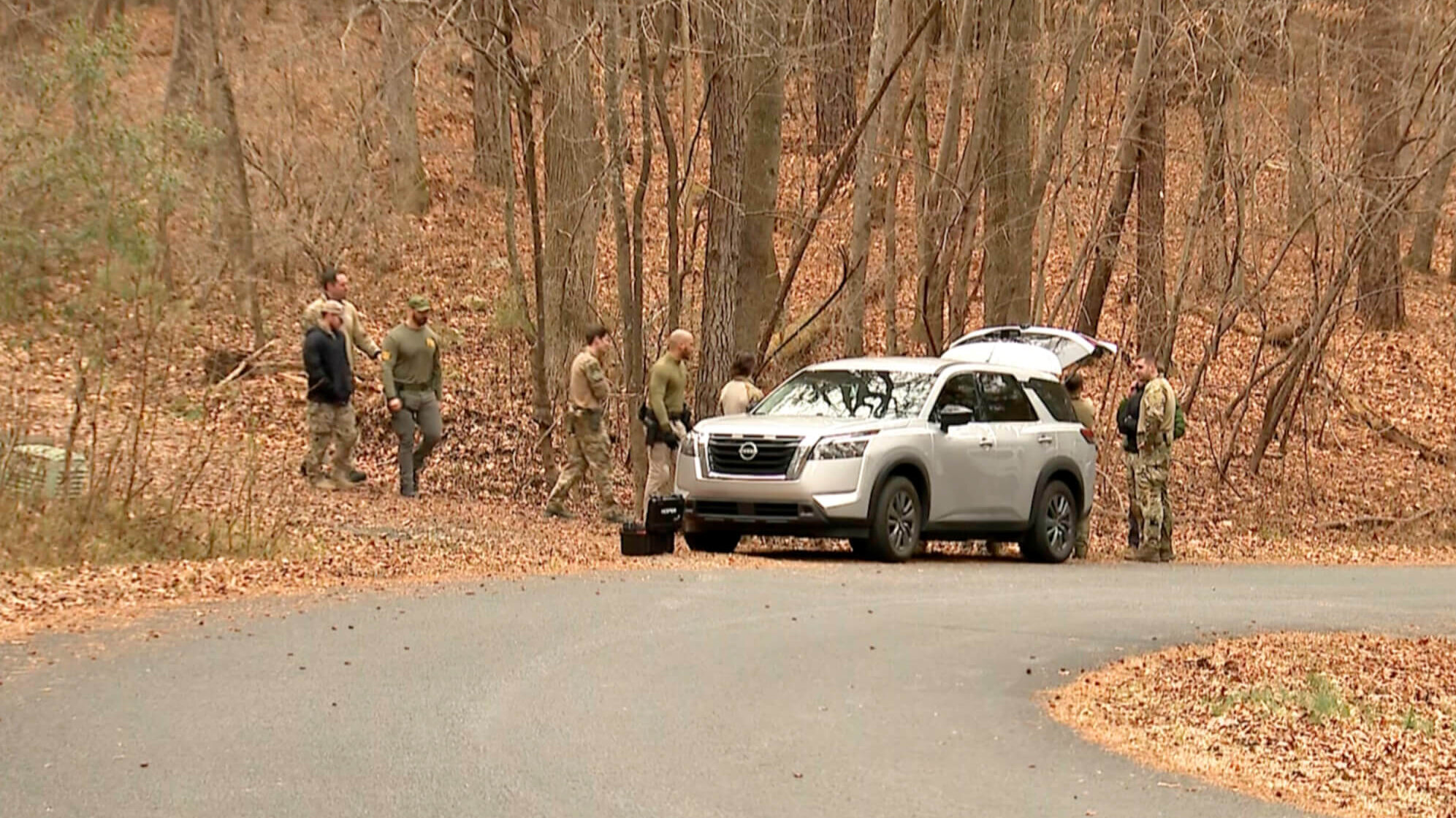 FBI agents search a neighborhood in Chapel Hill