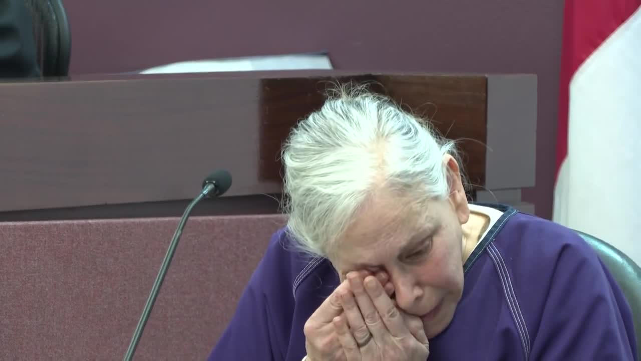 Donna Adelson wipes away a tear