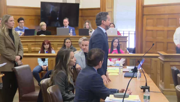 Alan Jackson stands at counsel table