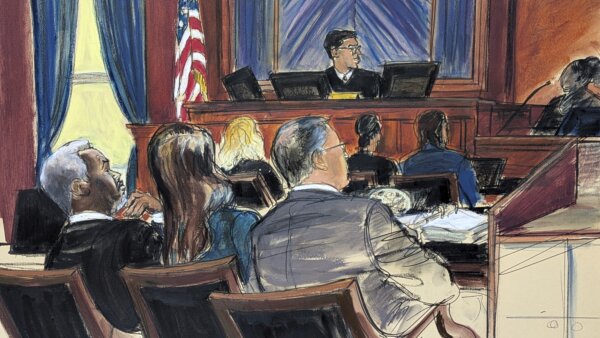 Sean 'Diddy' Combs, far left, looks on from the defense table