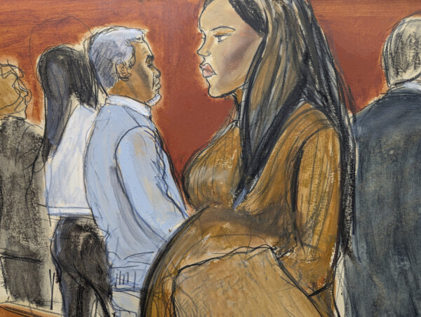Cassie Ventura, right, walks out of the courtroom past Sean Diddy Combs