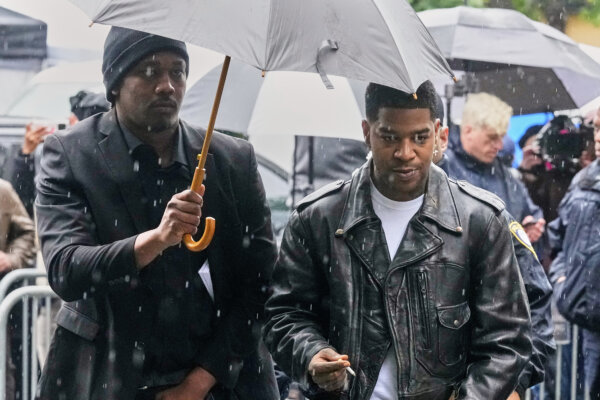 Rapper Kid Cudi, right, arrives at Federal Court for the trial of Sean "Diddy" Combs