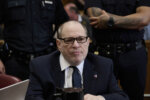old man in a sharp suit in court