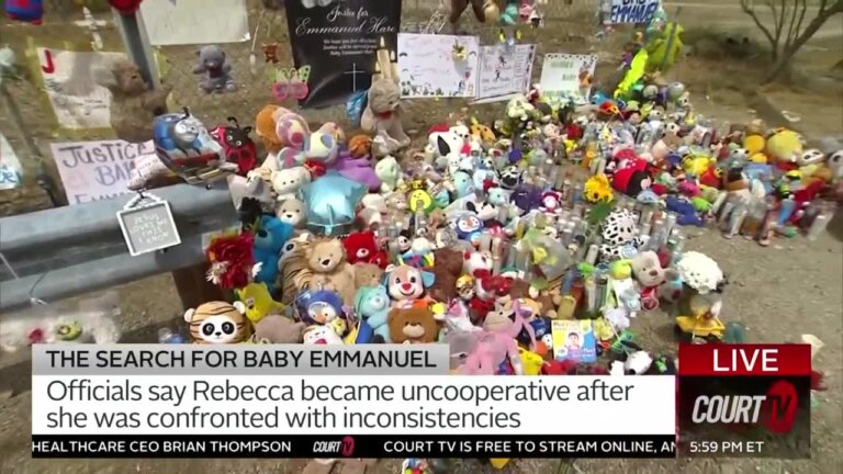 Memorial of stuffed animals and other baby items celebrating the life of Baby Emmanuel