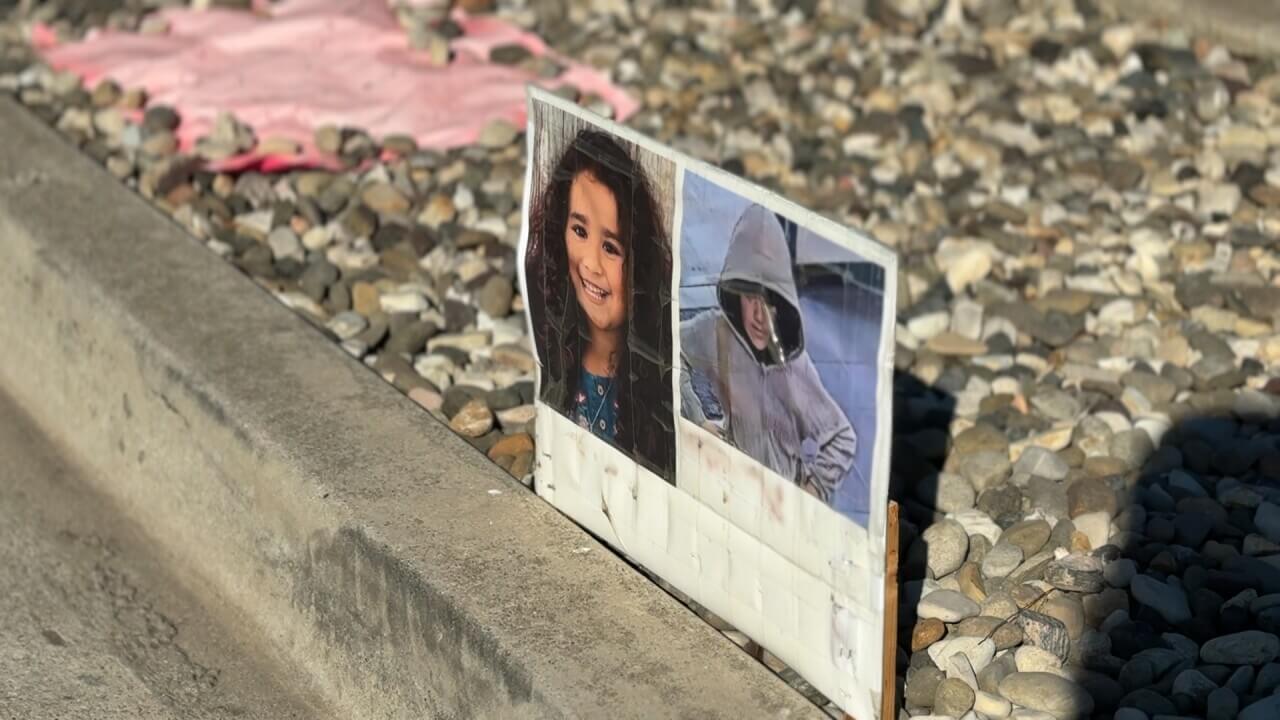 Sign with photo of Melodee Buzzard