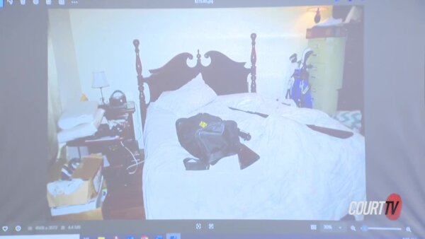 Guns visible on bed in photo