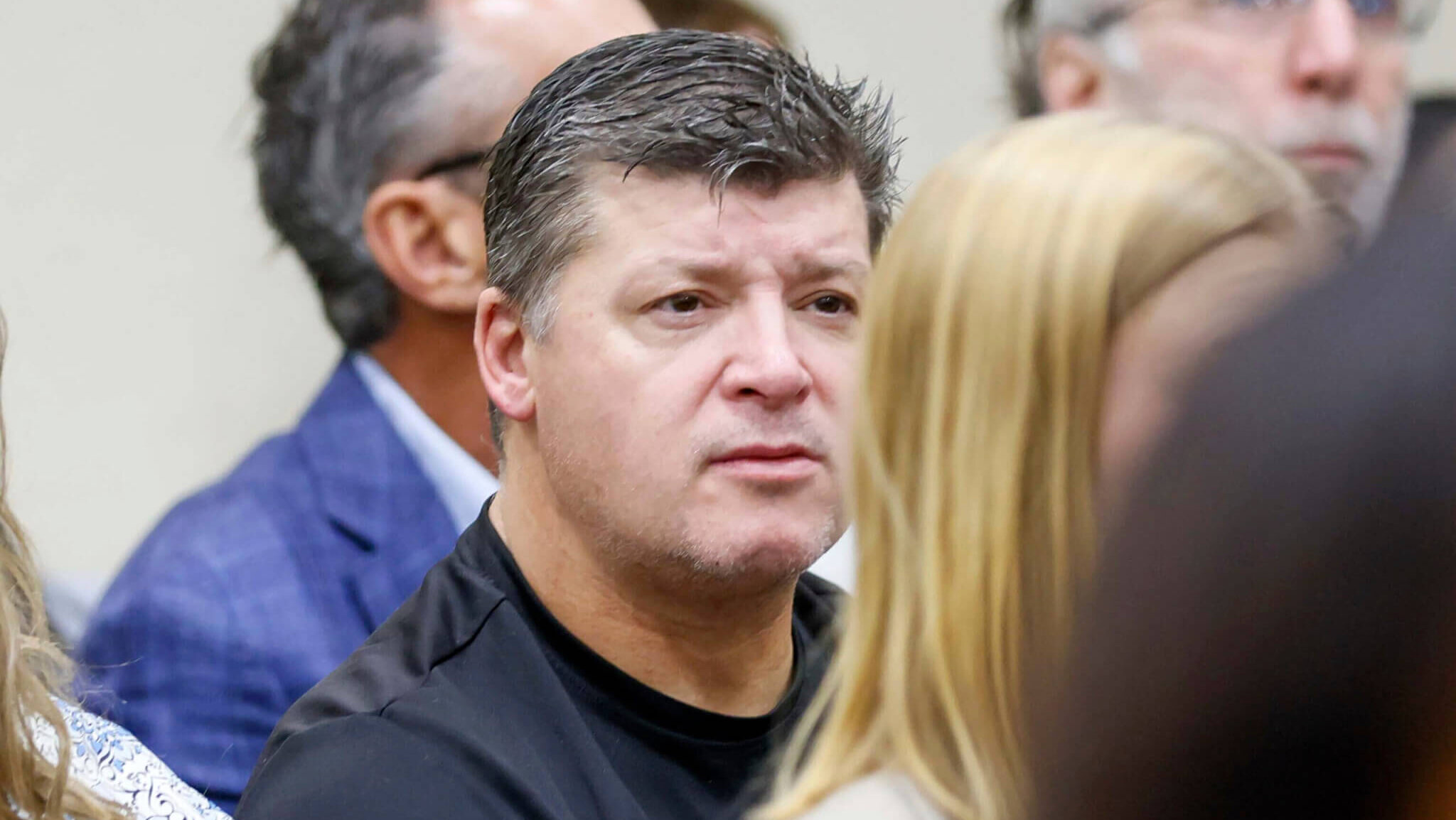 Jason Riley sits in court