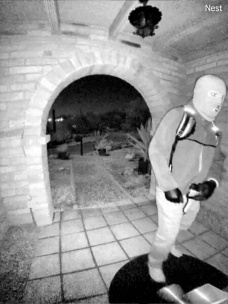 surveillance photo shows man in baklava and backpack