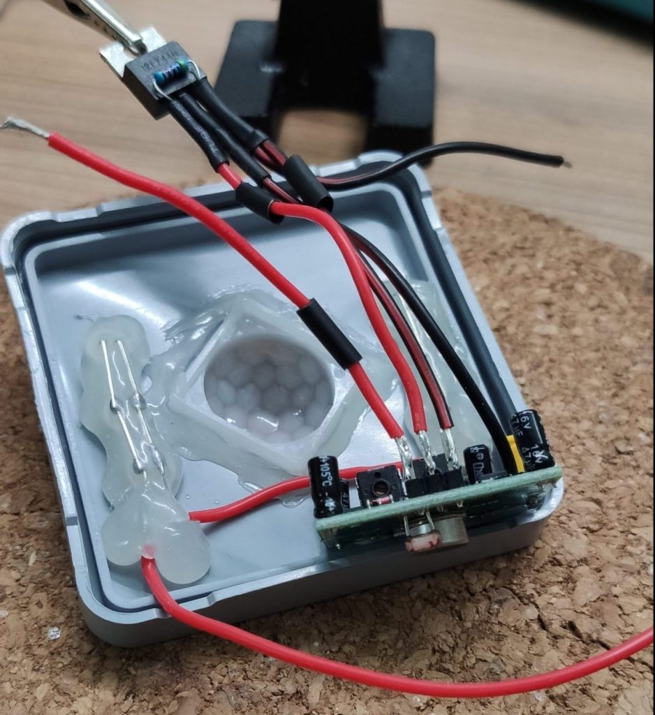 Top view of the lid and PIR sensor with all wires connected