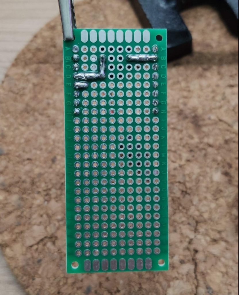 Bottom view of the soldered perfboard with buzzer connected to pin D6