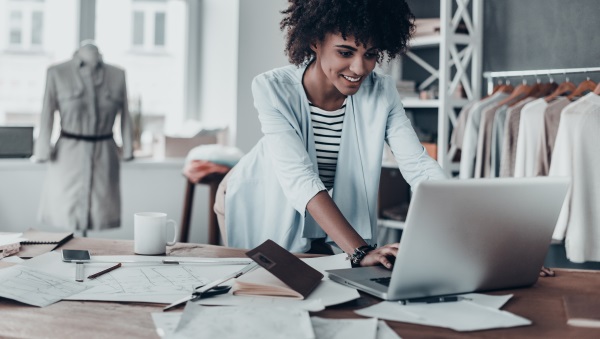 Woman happily logged in to her CRM system