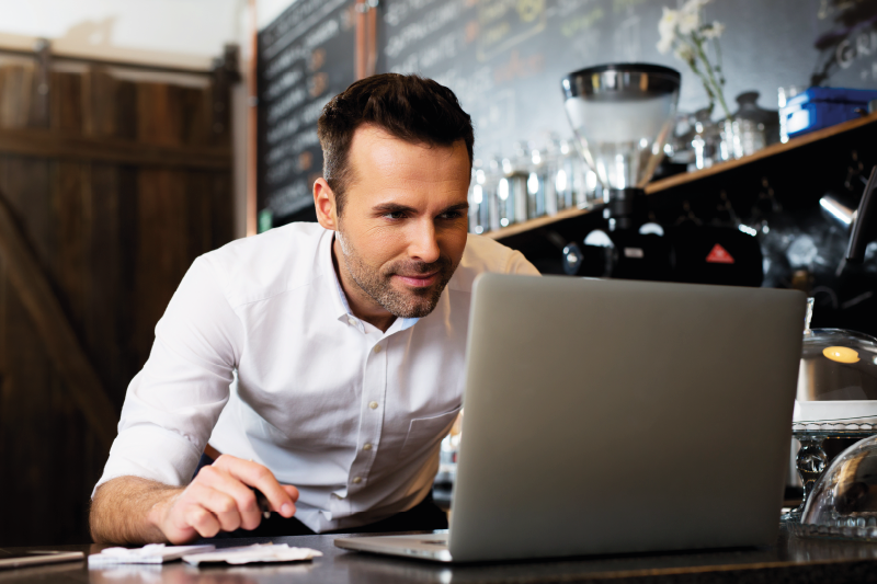 man looking up marketing trends