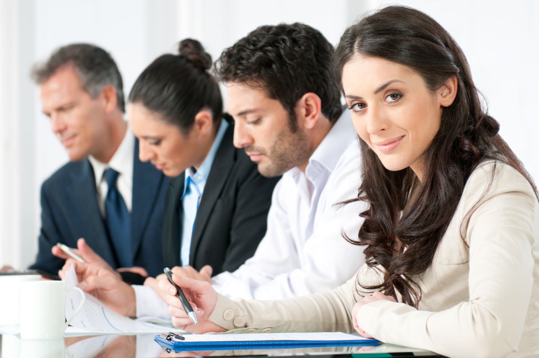 Woman smiling while using new CRM reporting features