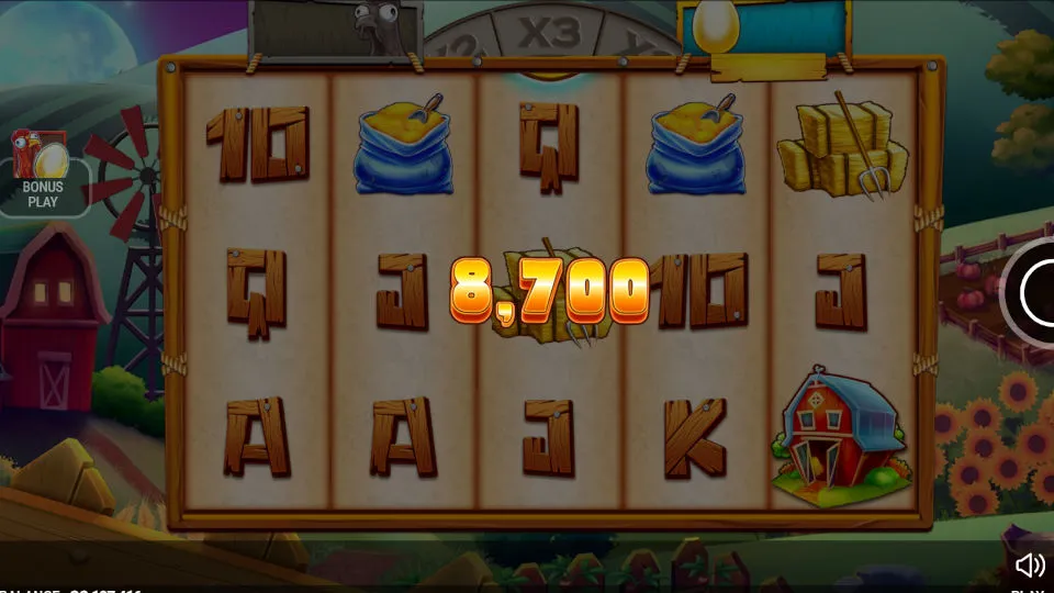 The Chicken or the Egg slot’s win screen showing a 8,700 GC prize with hay bale symbols and a cartoon barnyard setting.