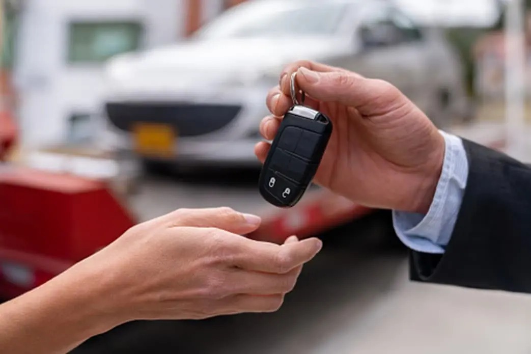 Manager Giving Keys For Test Drive