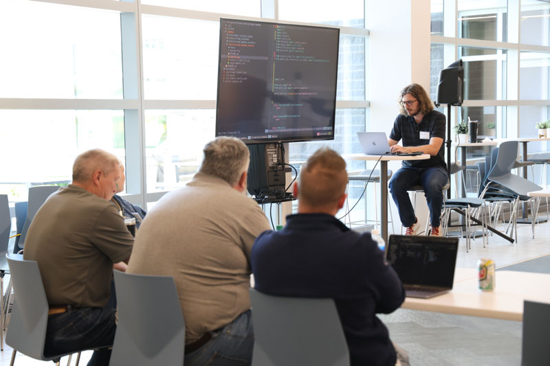 IMT employees working together on software project