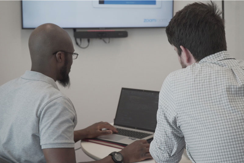 IMT employees collaborating on project