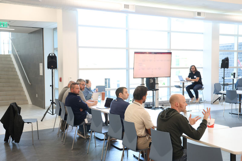 IMT employees meeting for software demo