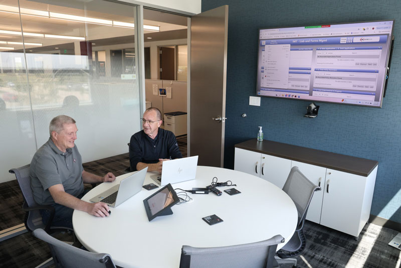 IMT employees collaborating on project