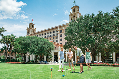 Family playing croquet on the Front Lawn