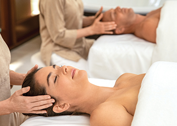 A woman getting a facial treatment at at The Breakers Palm Beach Spa