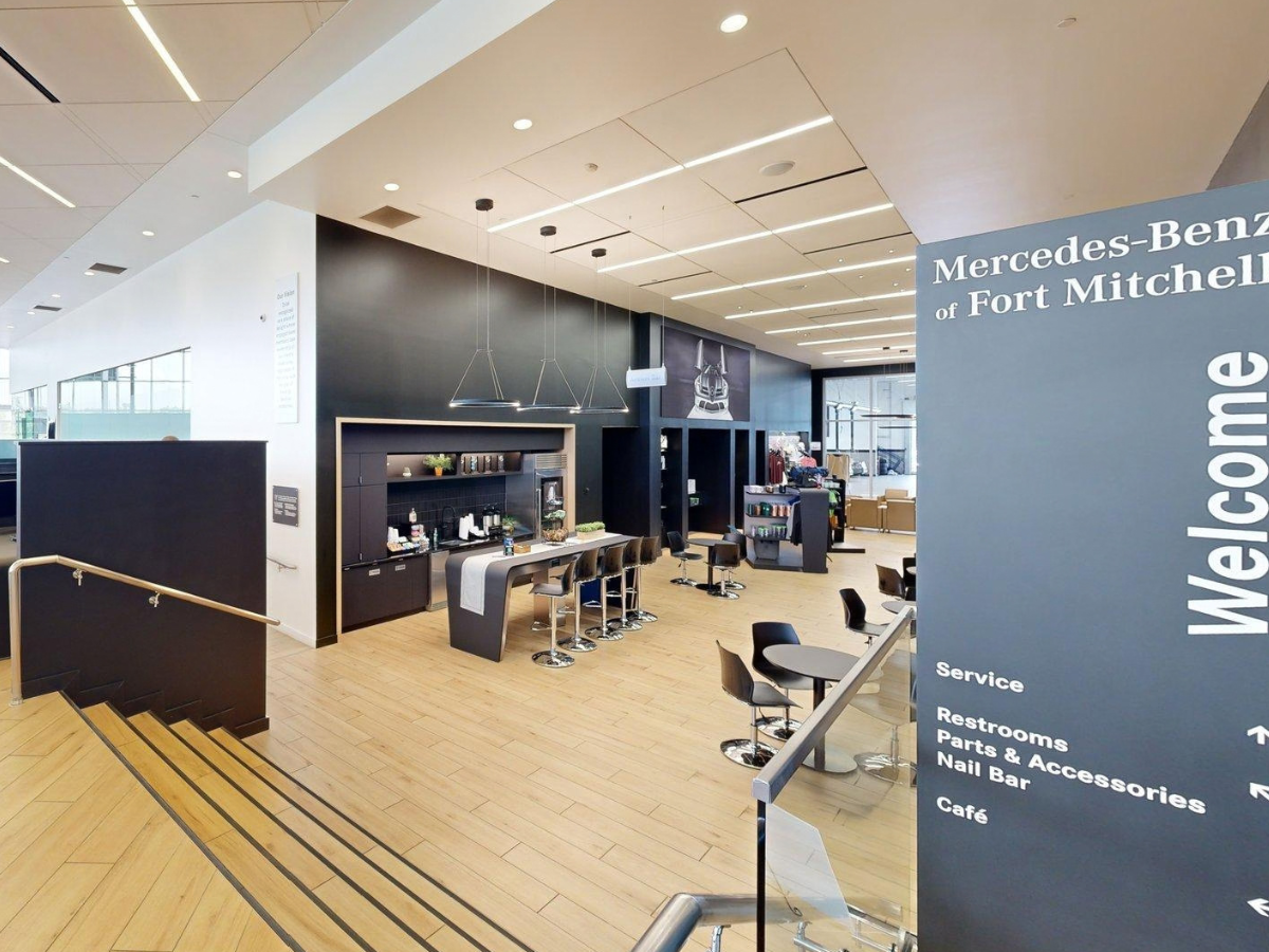 Coffee and snack bar near the welcome sign inside Mercedes-Benz of Fort Mitchell