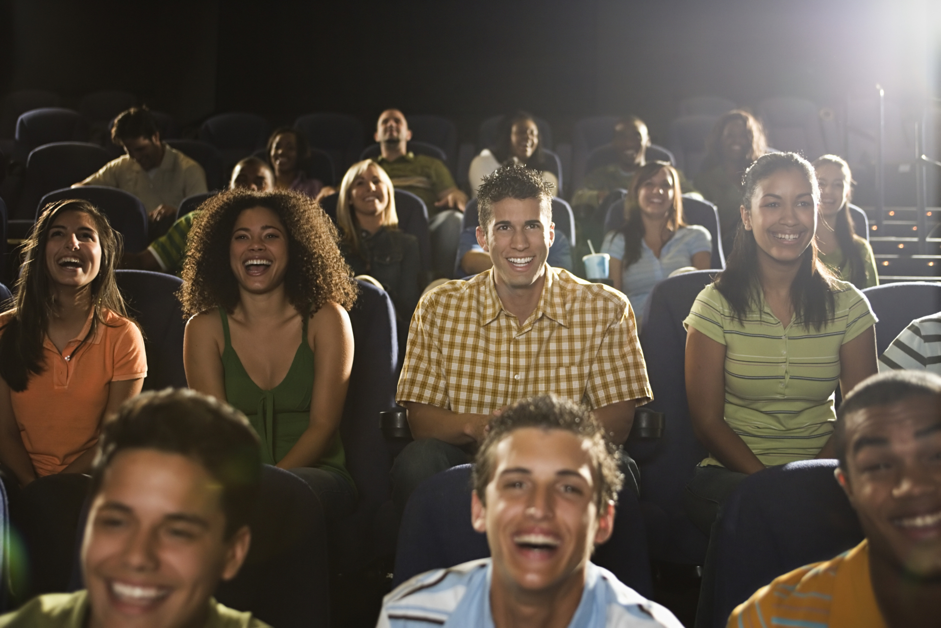 Theatre goer. Audience laugh. Watching a movie High. Laughter audience.