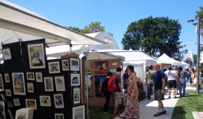 Patrons viewing a large selection of work.