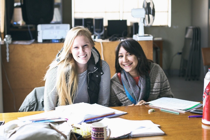 two linguistics students studying indigenous languages in peru