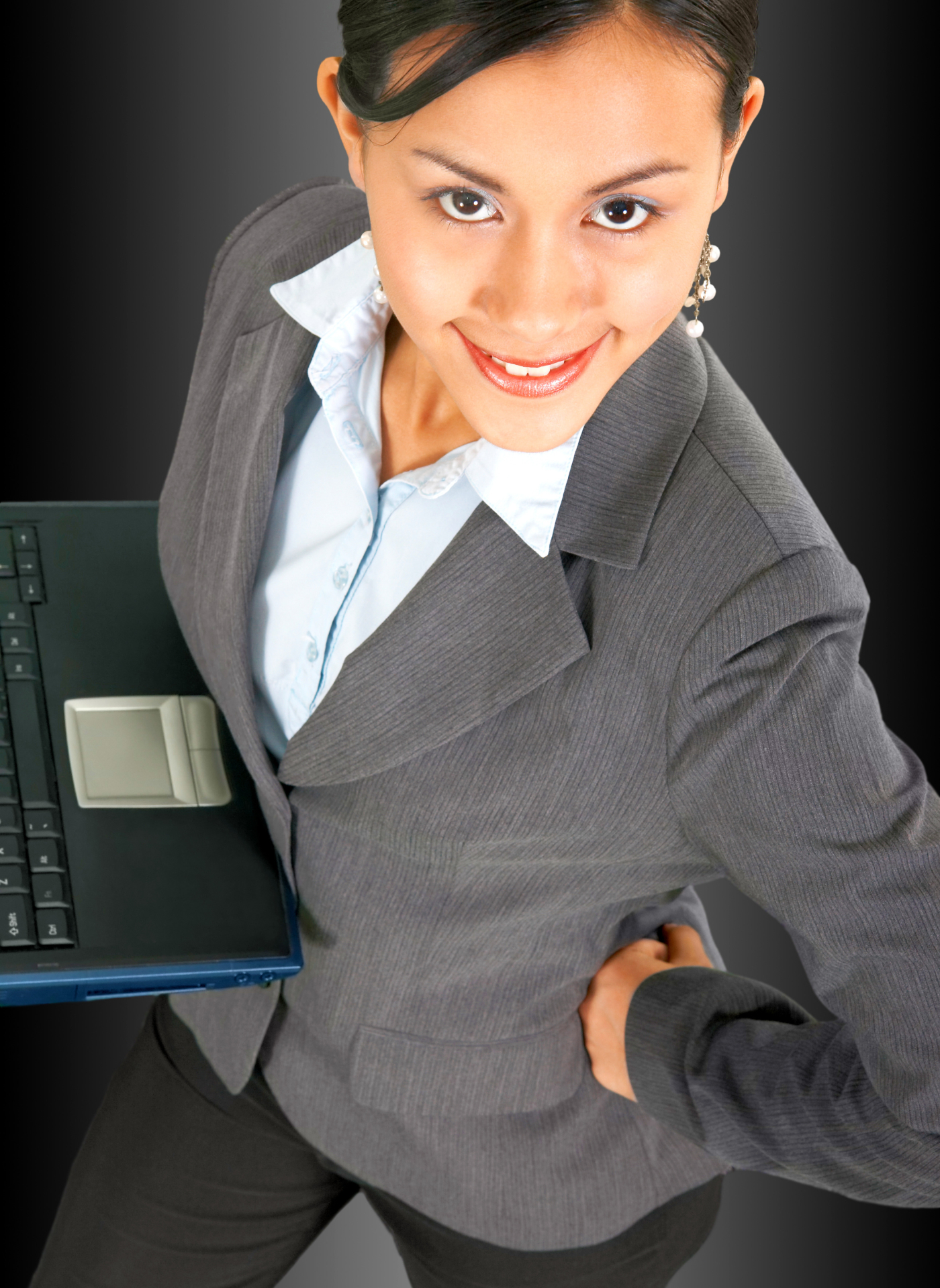 successful-business-woman-using-a-notebook-computer_GyHCT4wd