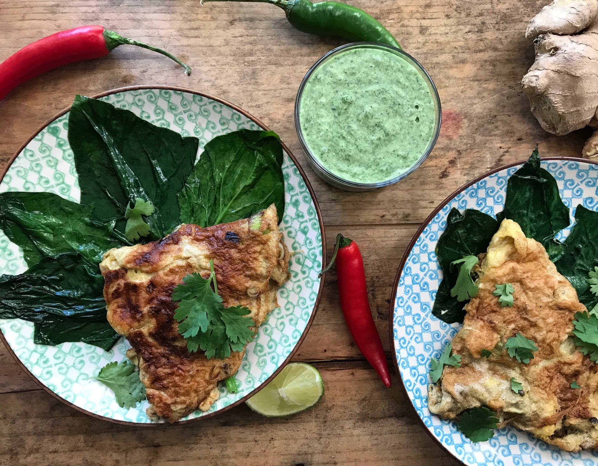 Omelette with Indian flavours: Spring Onions, Garlic, Chillies, Cumin, Coriander, Turmeric and Masala. Perfect with a velvetly smooth and cooling chuttney with Coriander, Mint, Green Chillies, Ginger, Garlic, Coconut Cream, Salt, Sugar and Lime. Some beautiful and tasty Spinach on the side.0