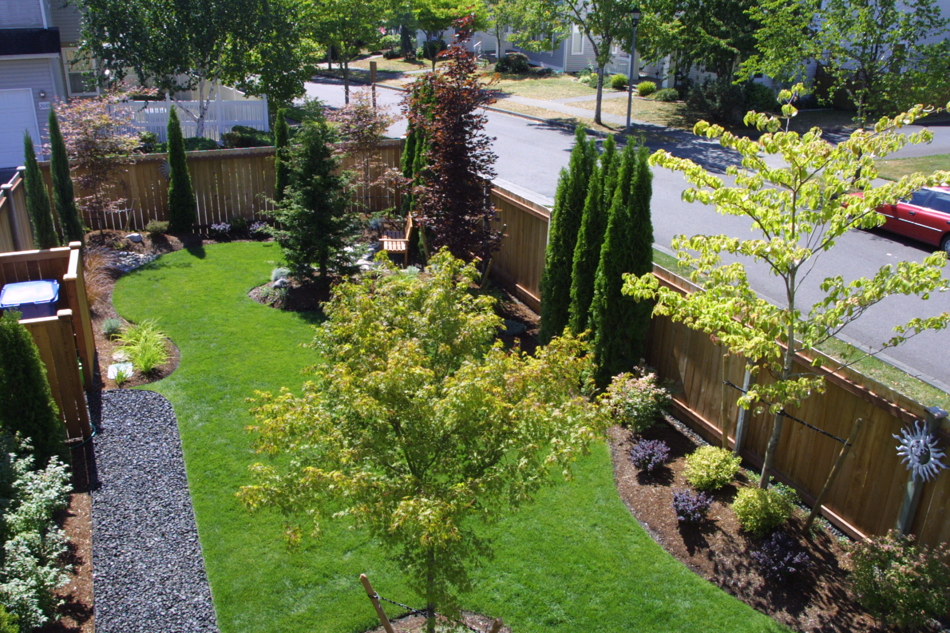 Landscape maintenance after installation. Fertilizer and bark Mulch pruning, prune