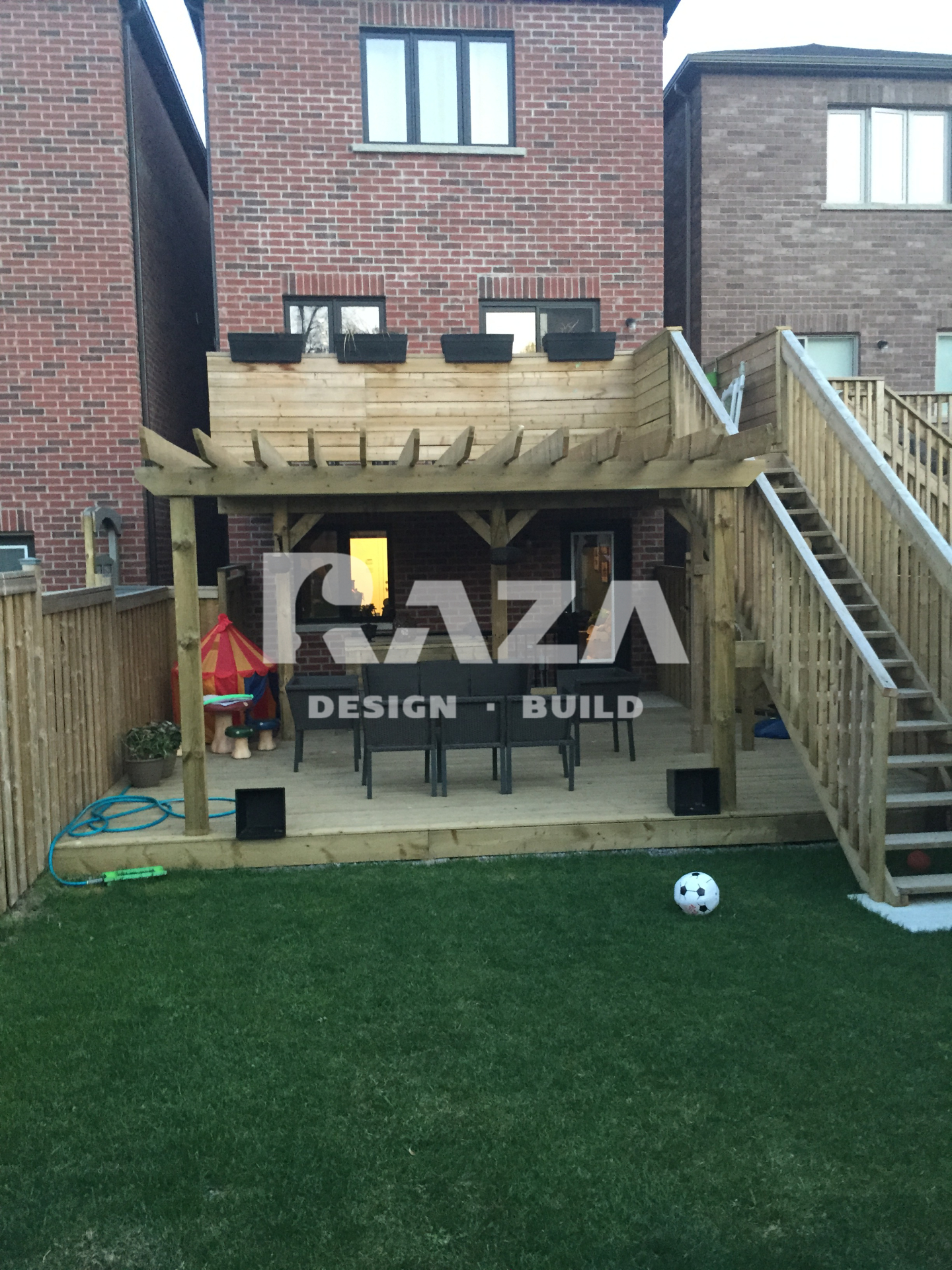 Pressure treated deck with railing, stairs, lower deck and pergola