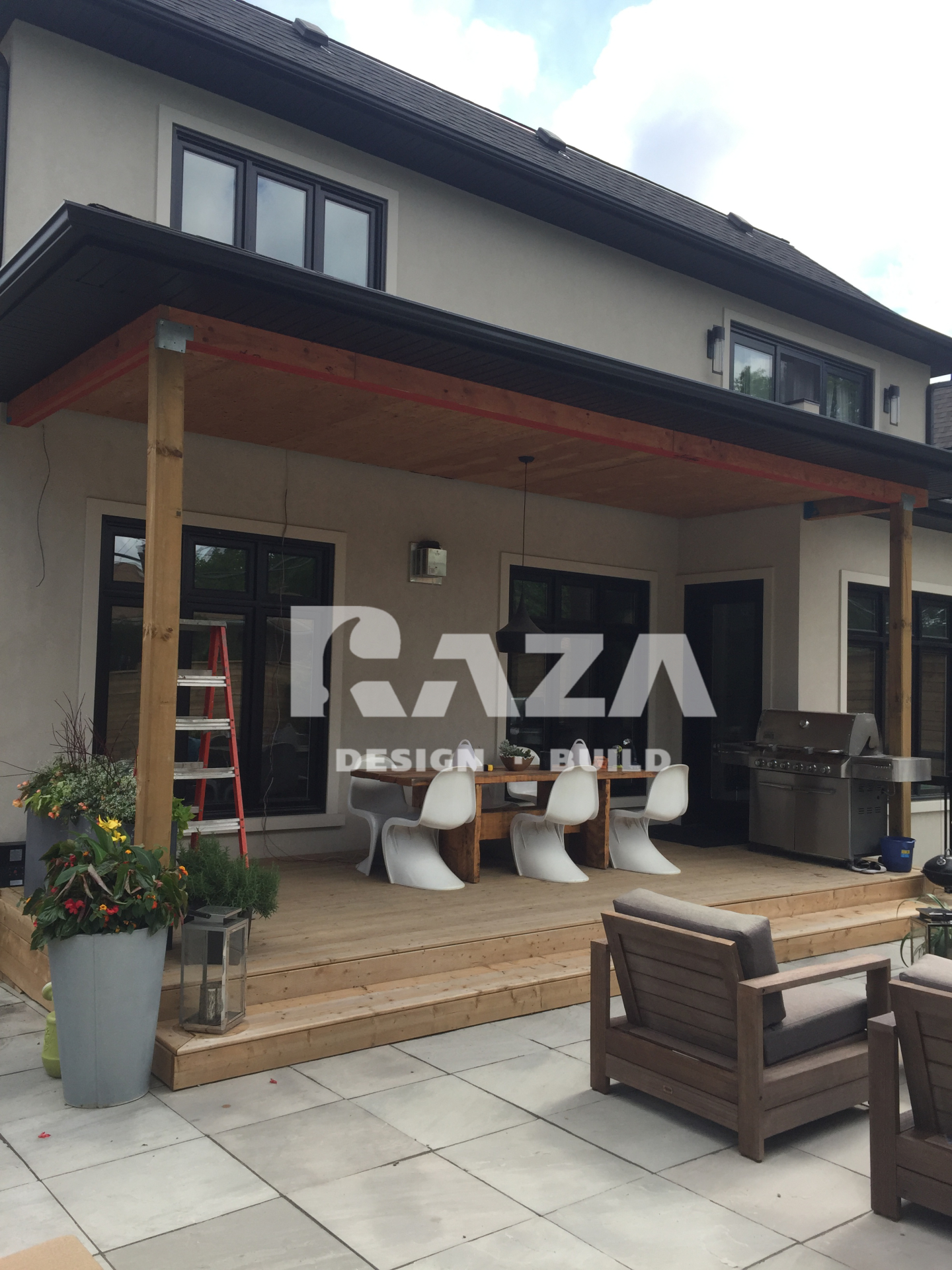 Pressure treated covered deck with wrap around steps