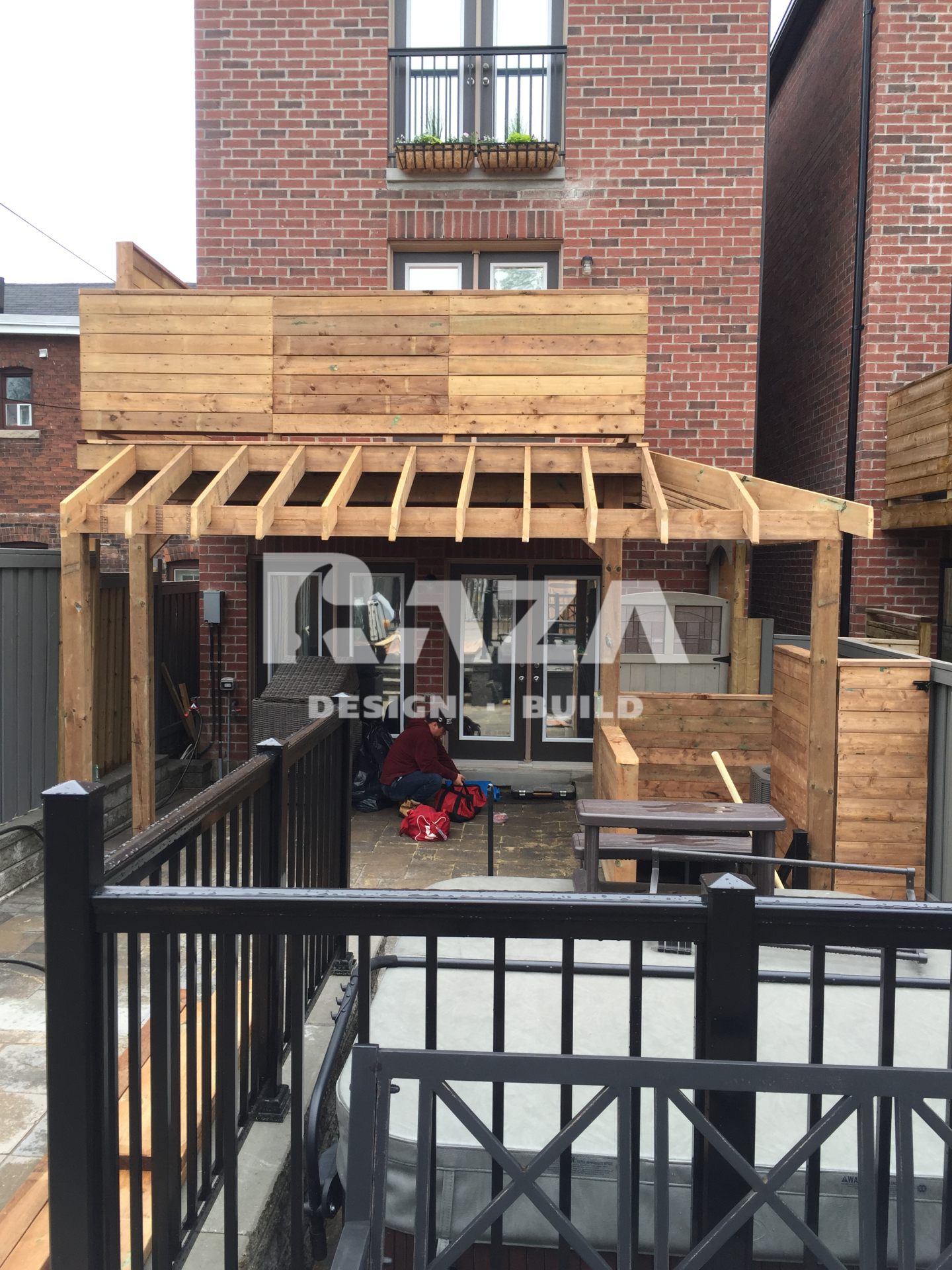 Pressure treated deck with railing and custom roof type pergola